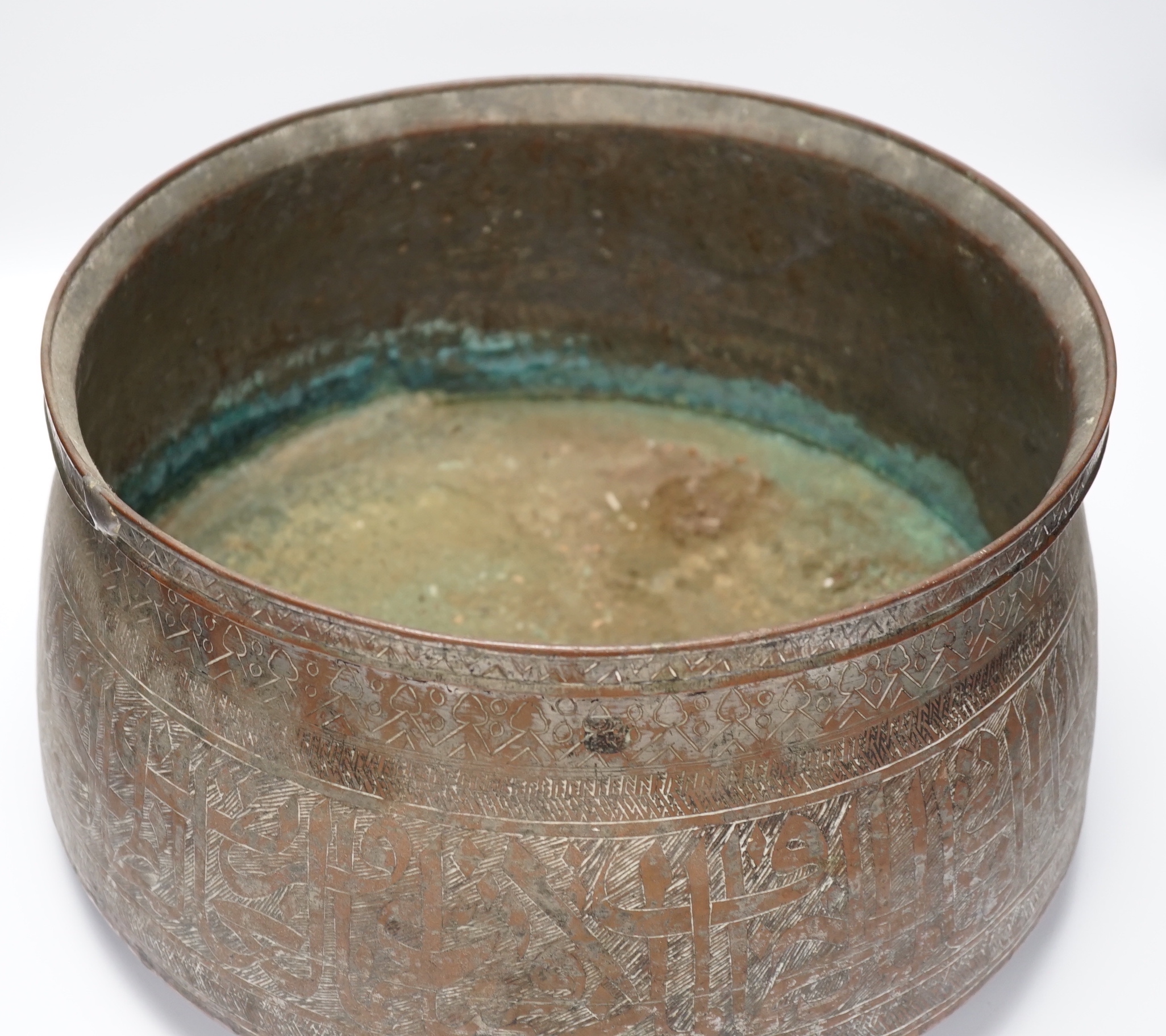 A large Islamic tinned copper bowl, inscribed in Kufic script, 38cm diameter